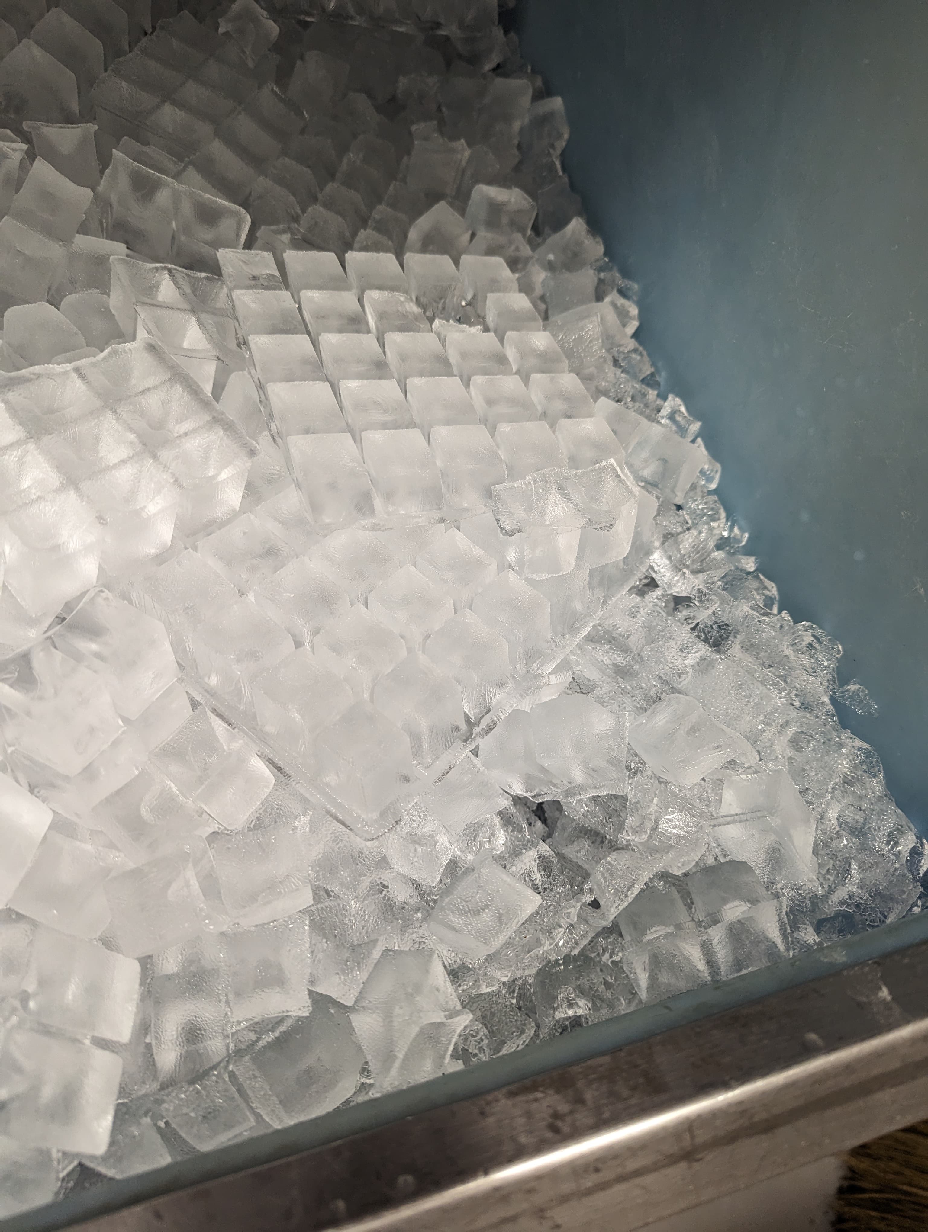 Full bin of fresh ice cubes