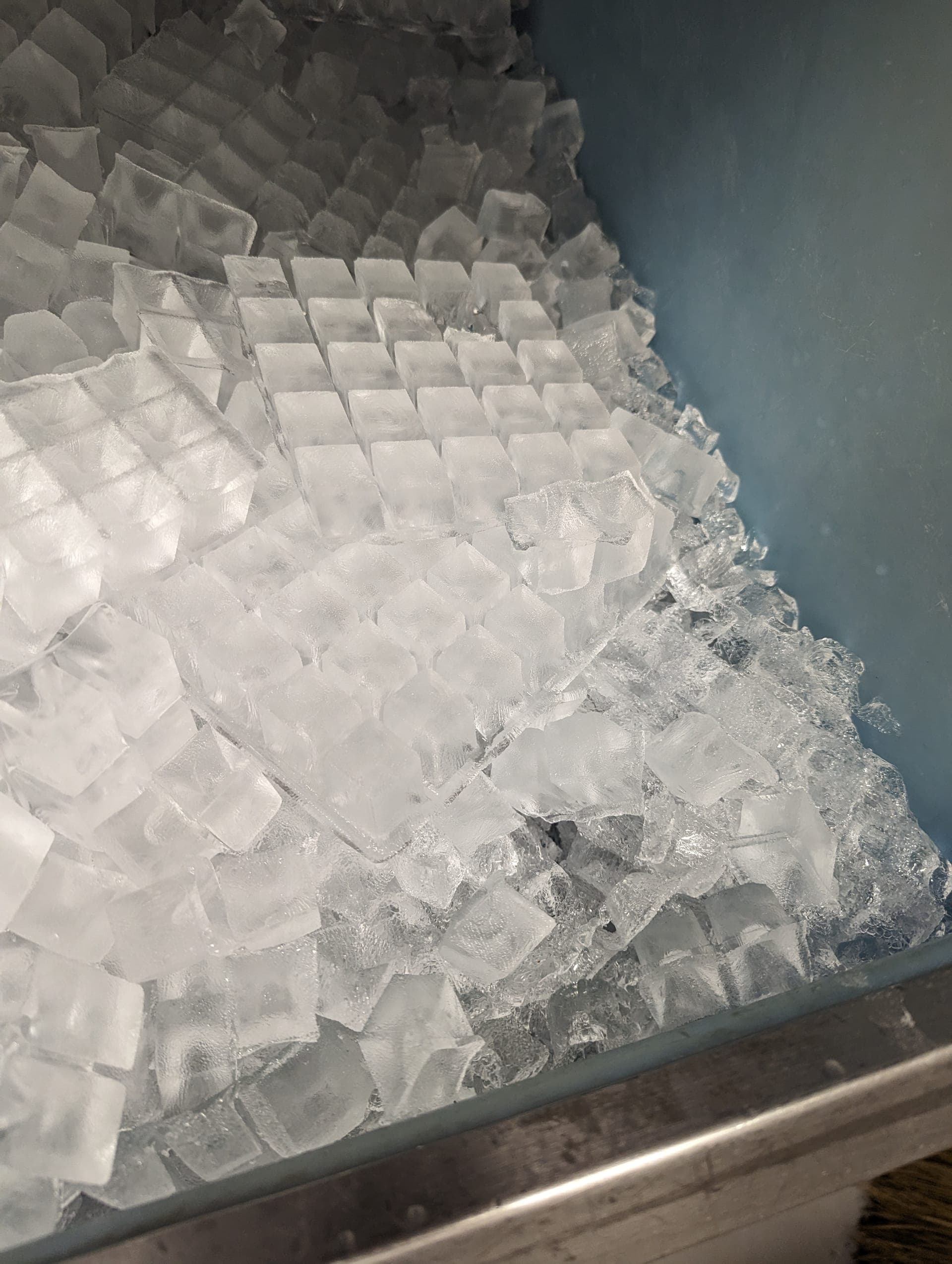Full bin of fresh ice cubes