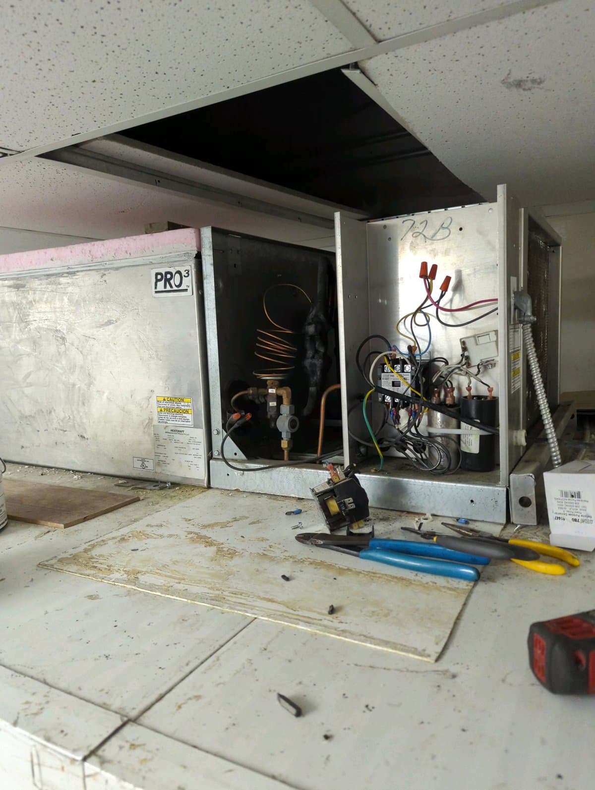 YYC Mechanical technician repairing commercial refrigeration compressor in Calgary restaurant